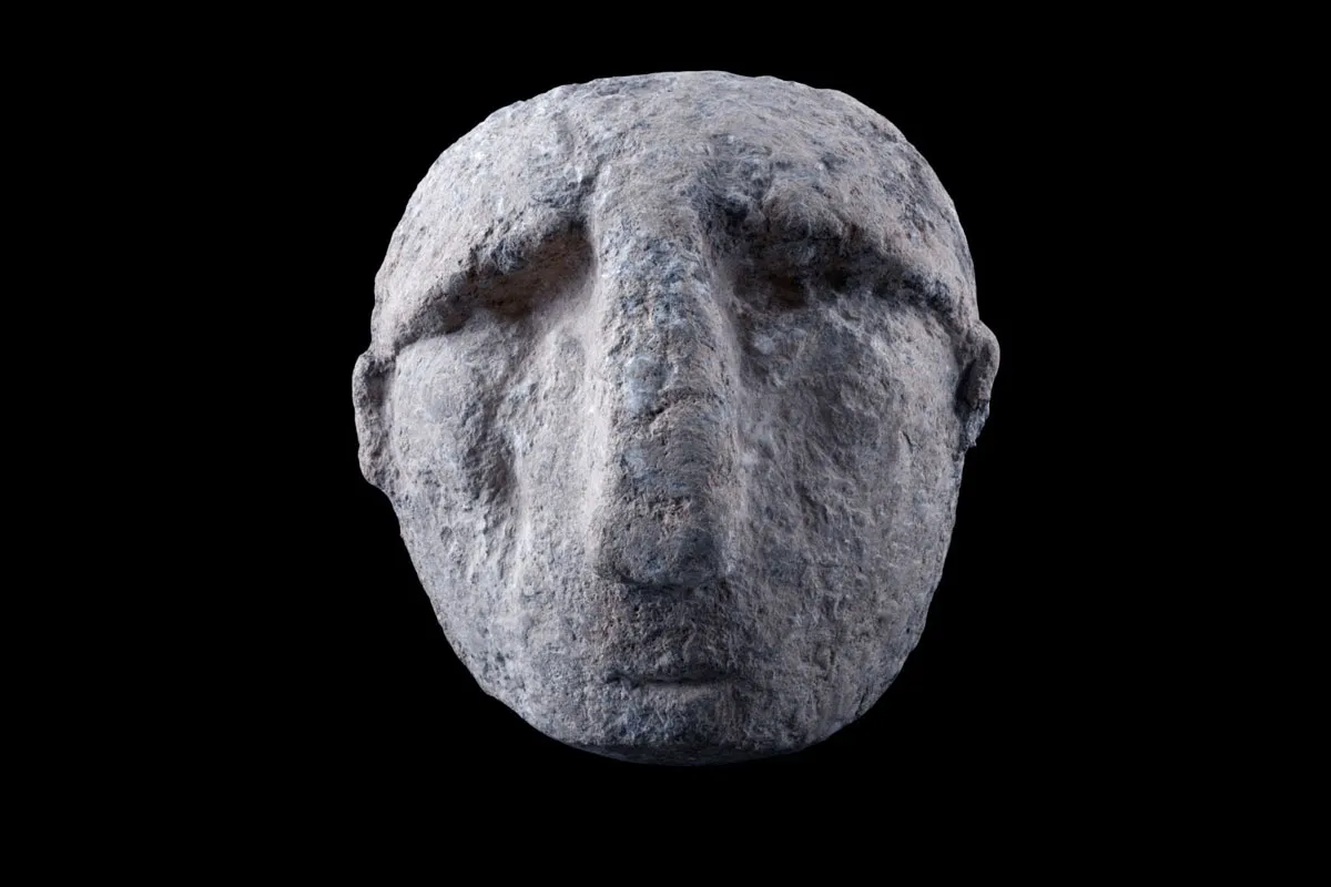 Neolithic stone carving of man's head from Karahantepe