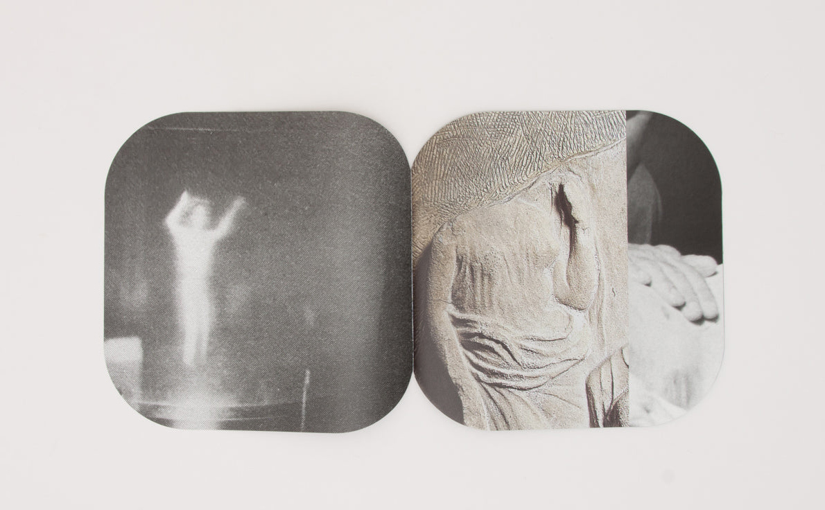 MMDC3, spread: fountains among stepped stone basins, with a loose printed text sheet