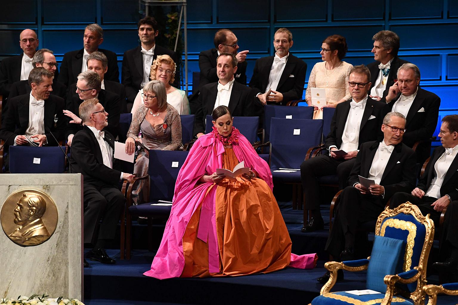 Former Swedish Academy permanent secretary Sara Danius (centre) sitting in the Concert Hall in Stockholm prior to the Nobel Prize Award ceremony on Dec 10, 2018.